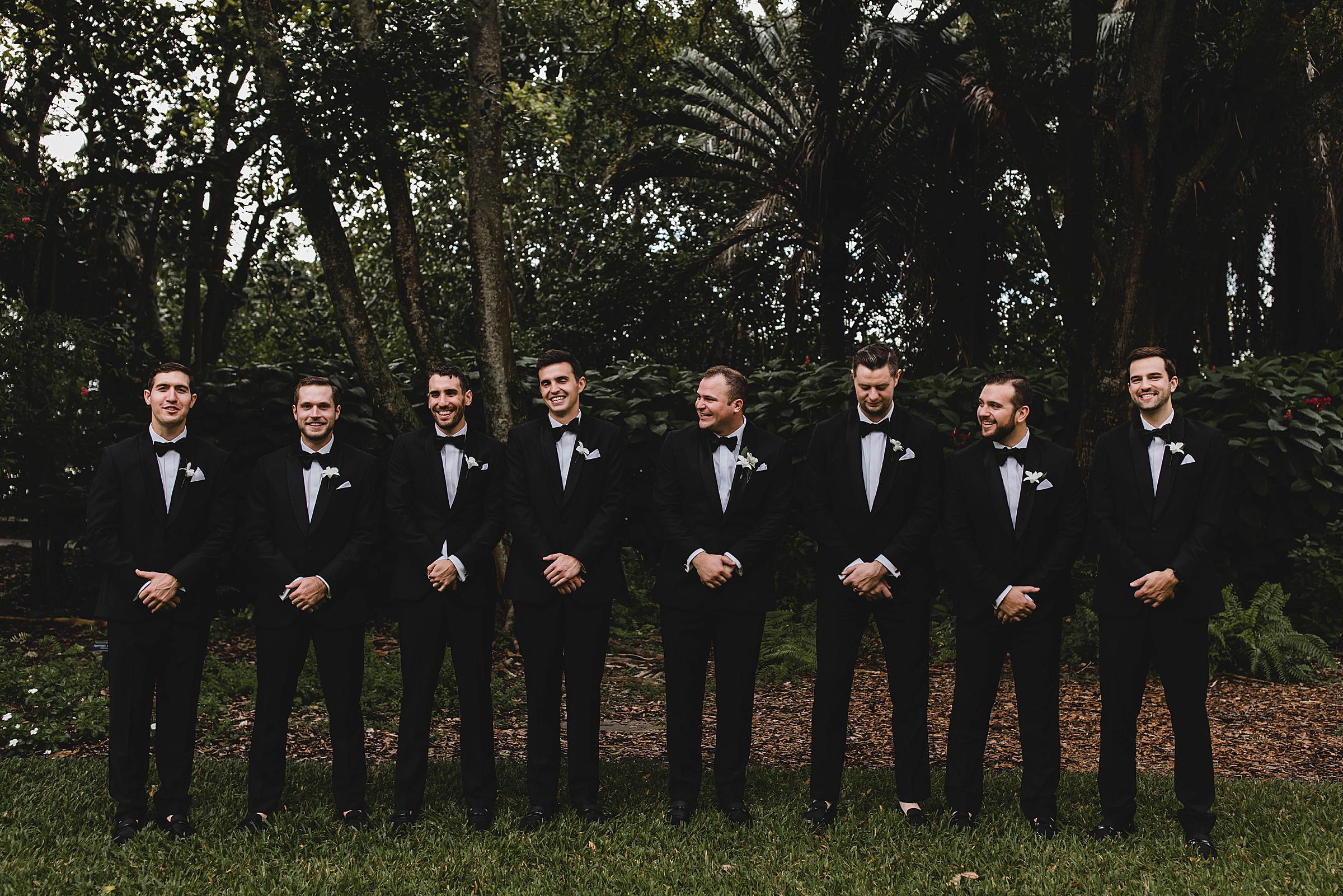 groomsmen laughing at selby gardens wedding in sarasota florida