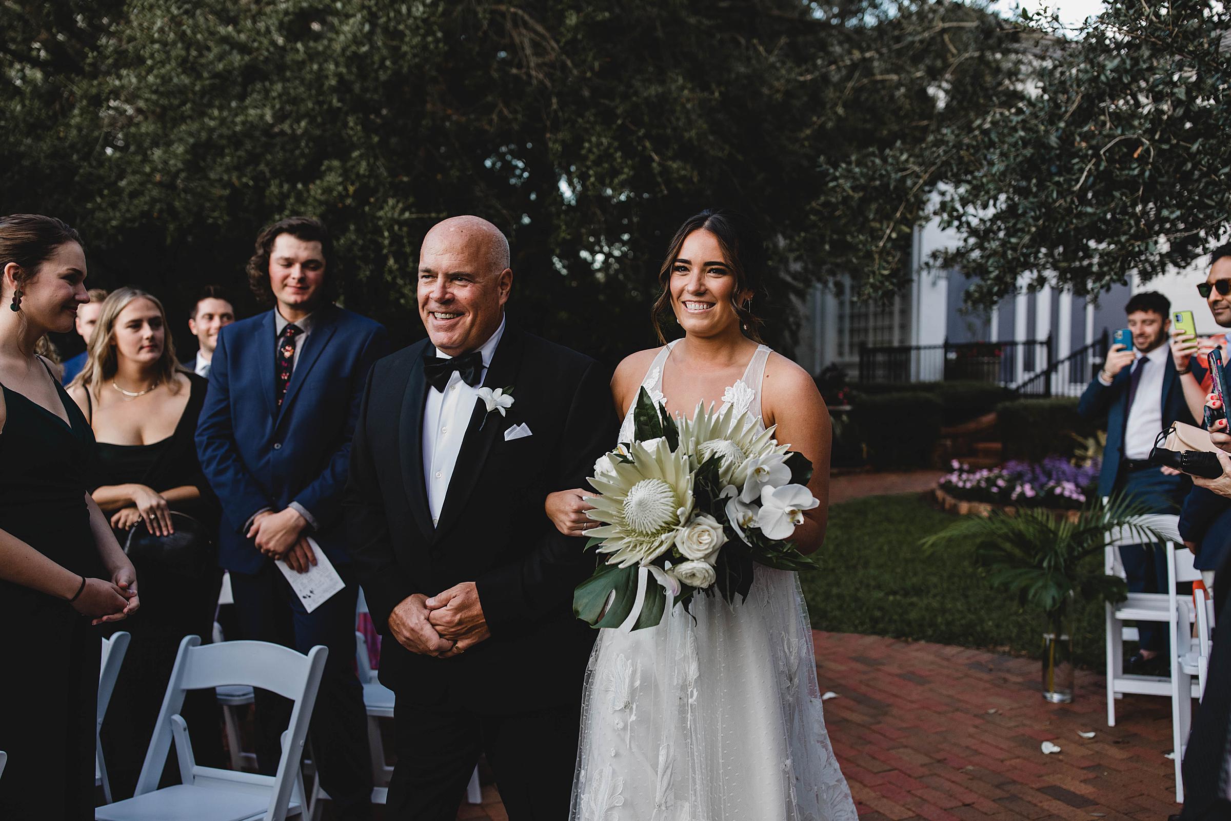 Bride and father of the bride walking down the aisle at selby gardens wedding