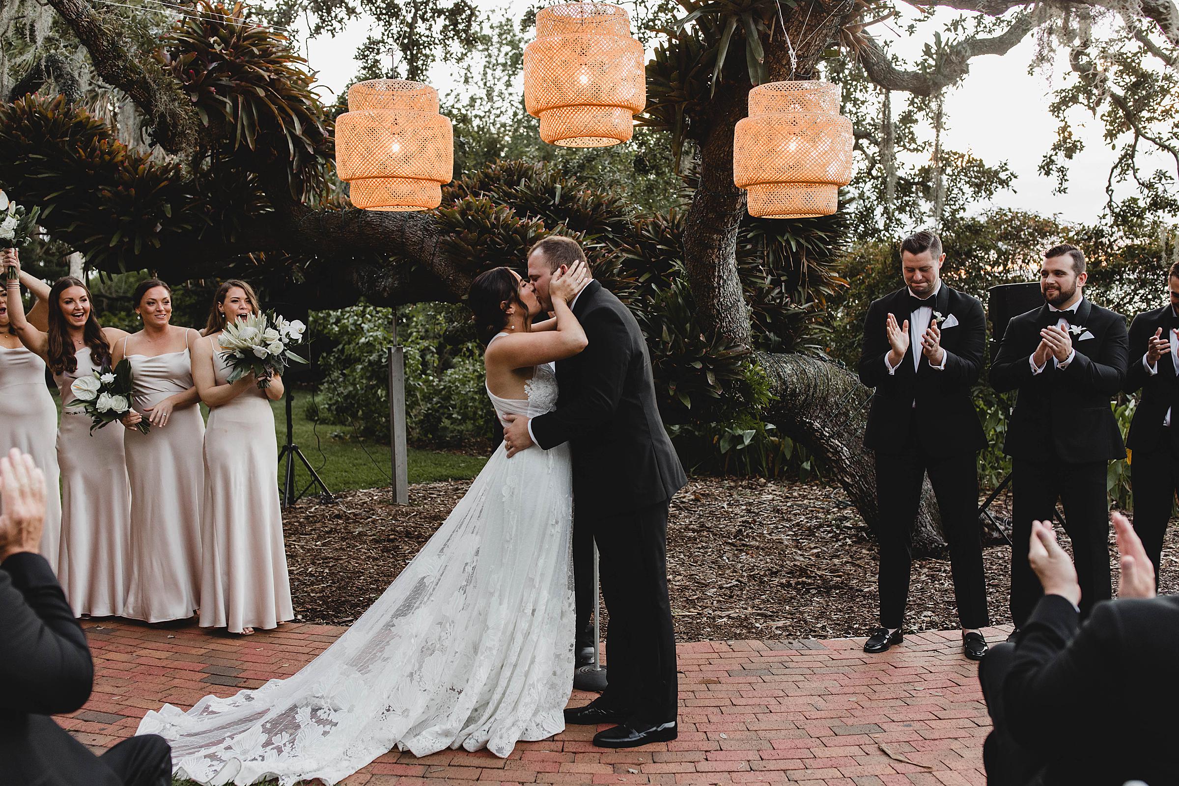 Bride and groom's first kiss at the end of ceremony at Selby Gardens wedding