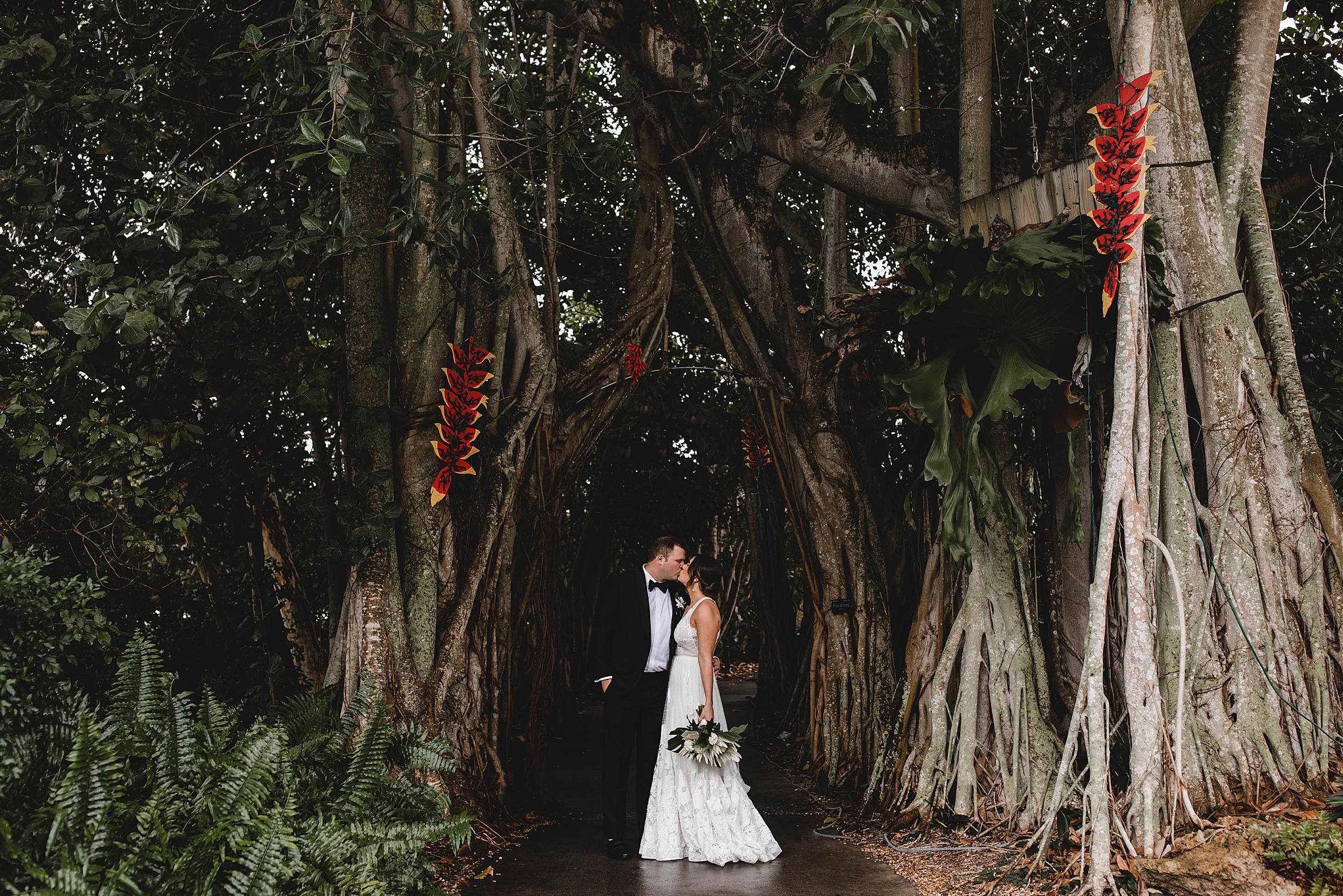 bride and groom kissing, bride and groom portraits at marie selby botanical gardens wedding