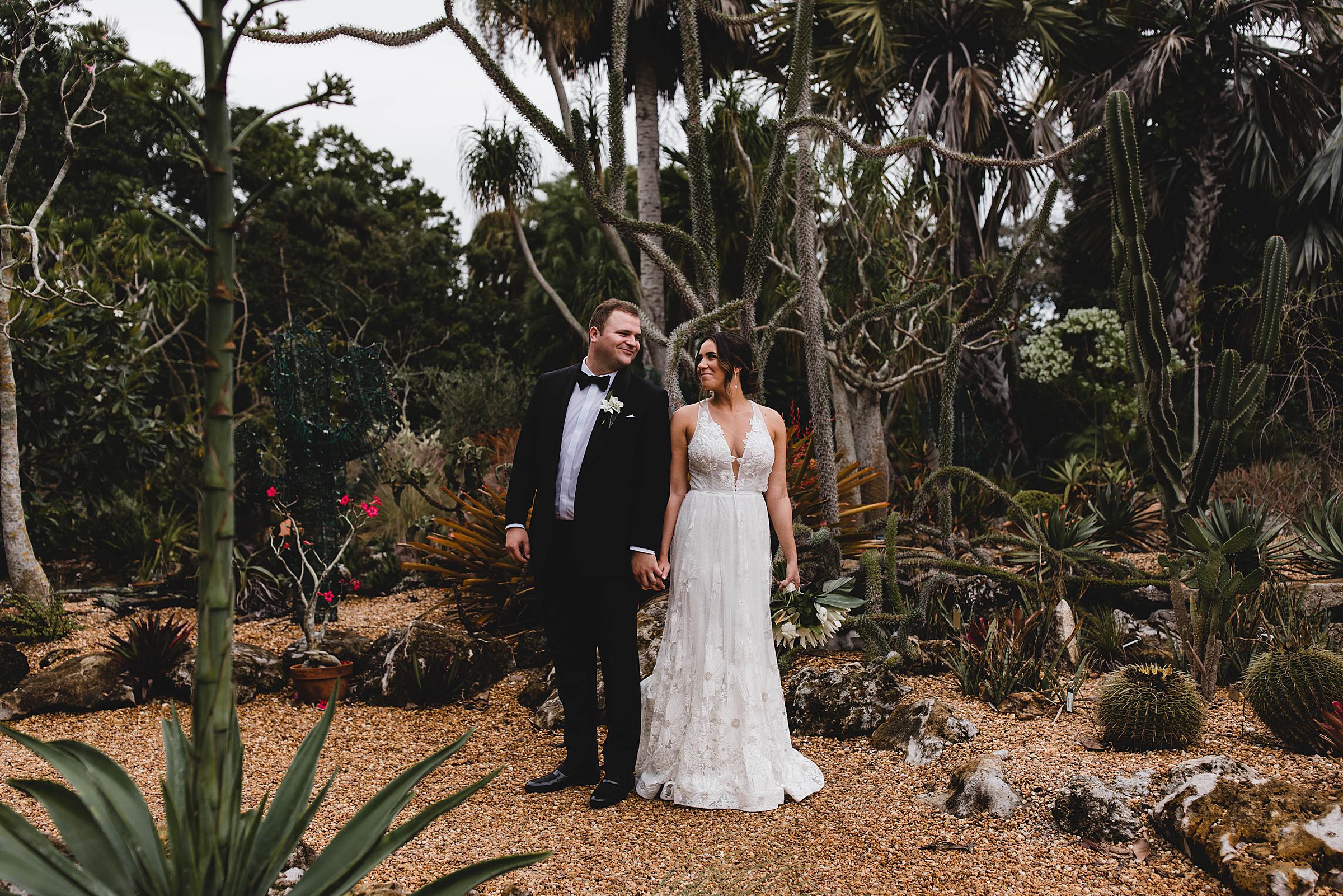 couple looking at each other, bride and groom portraits at marie selby botanical gardens wedding