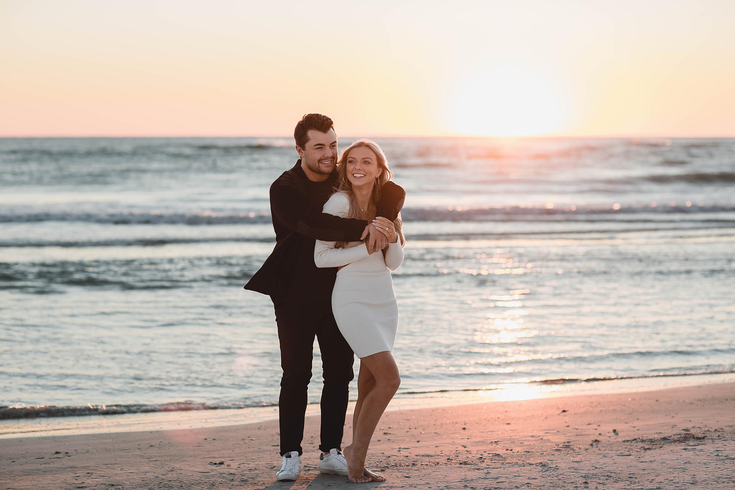 Couple smiling on beach, lido beach engagement photos after surprise proposal