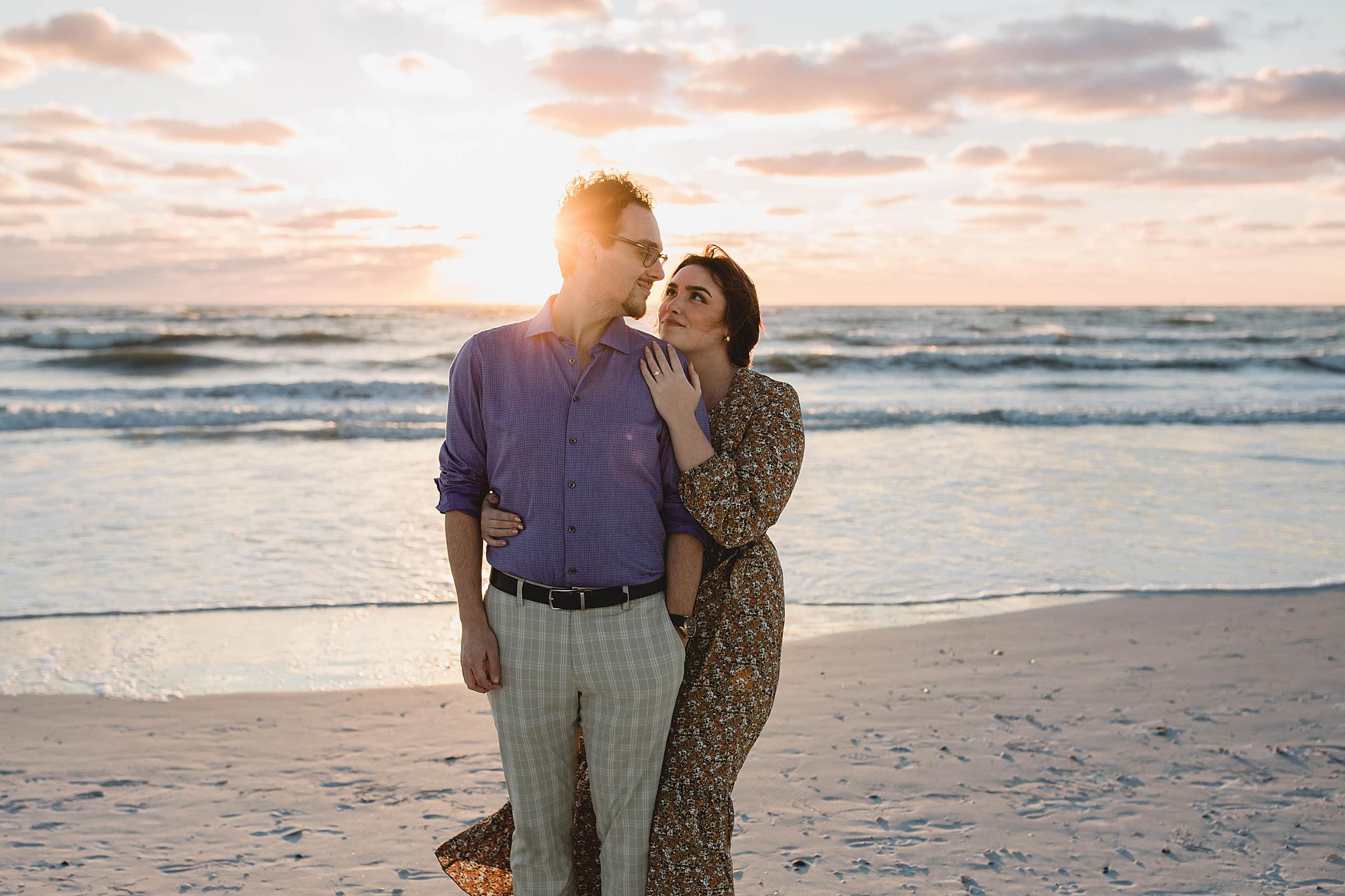 Newly engaged couple looking on each other, Lido Beach engagement session, Sarasota Florida surprise proposal