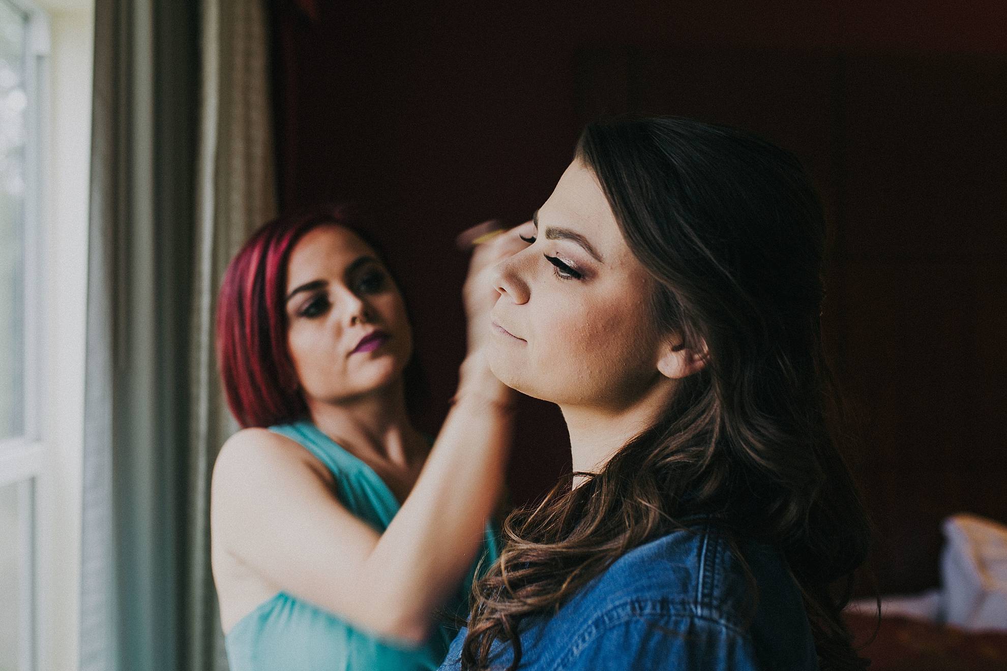 Omaha Bride getting makeup done