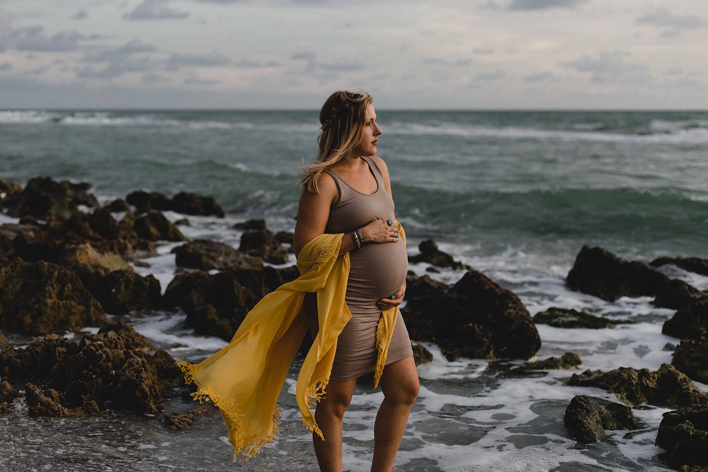 Maternity session with girl on beach with rocks,Maternity session in venice fl, caspersen beach maternity session, photographer in sarasota fl, juiana montane photography