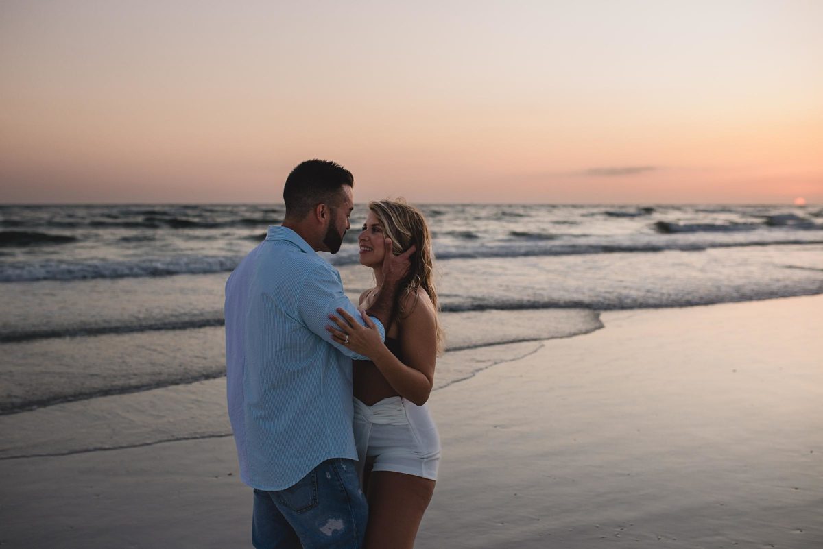 couple just engaged on lido beach florida photographed by juliana montane photography