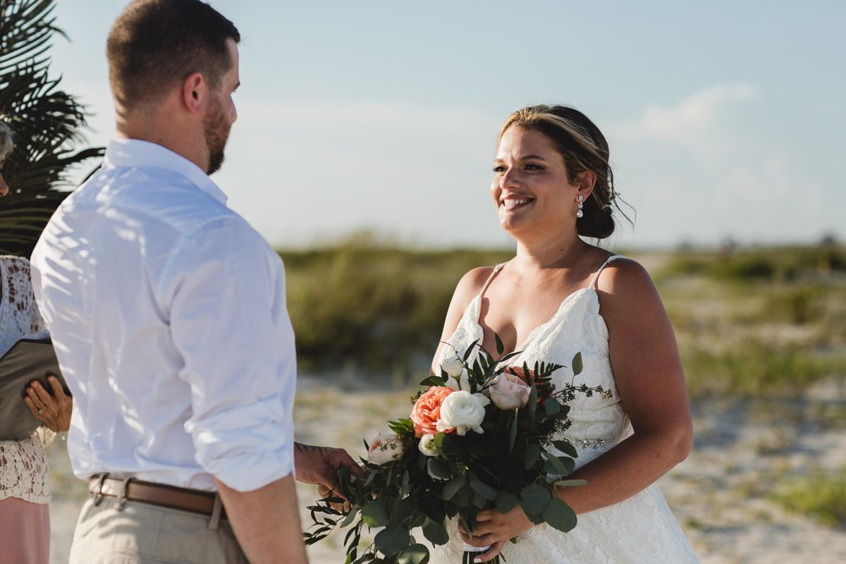 bride and groom holding hands at for clearwater beach elopement photographed by juliana montane photography