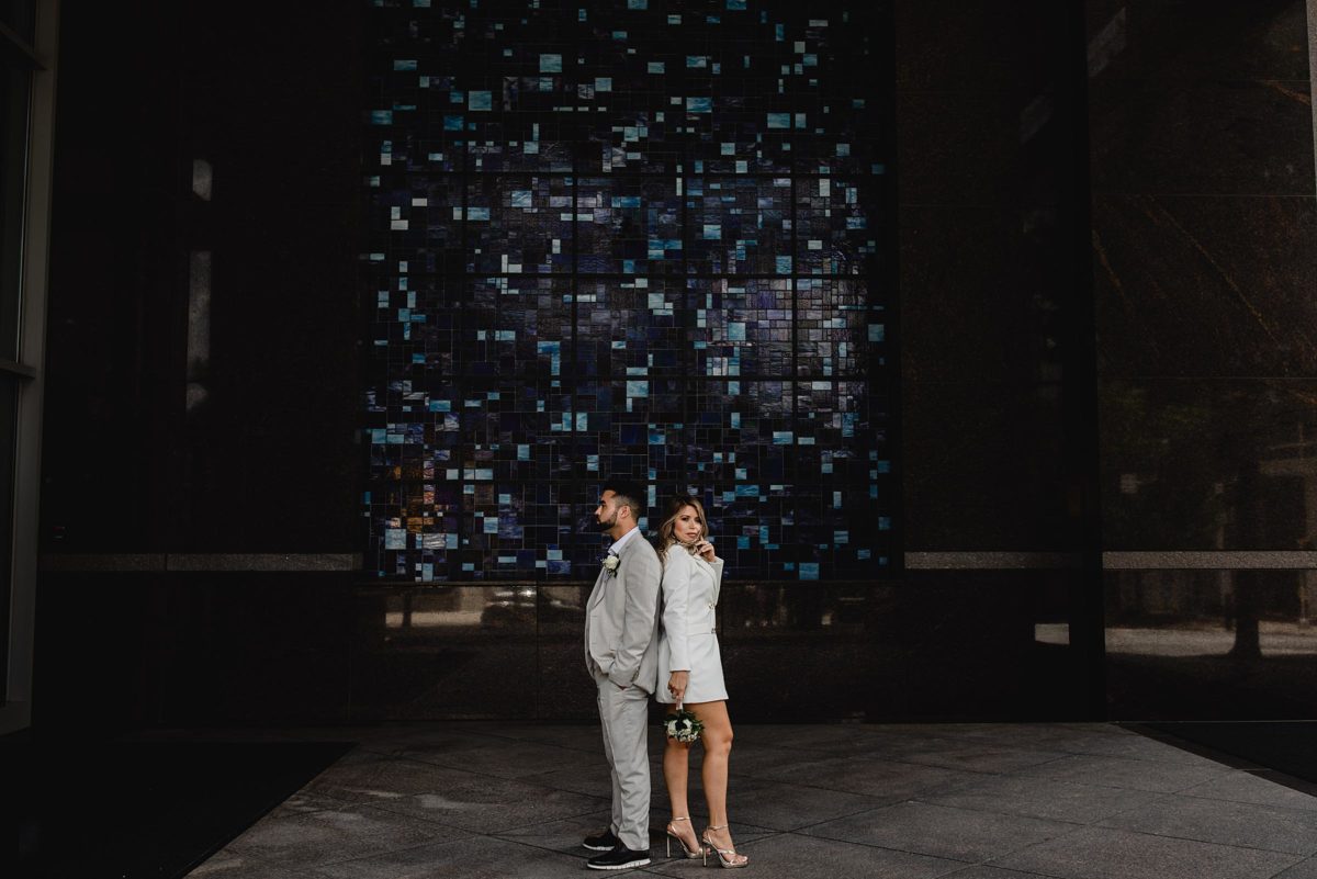 bride & groom walking down the street at downtown atlanta elopement photographed by juliana montane photograhy
