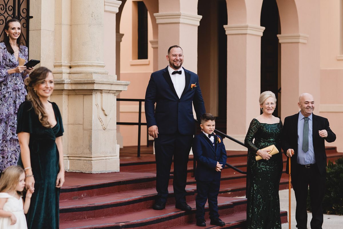 Groom watching his bride come down the aisle at downtown sarasota wedding, photographed by Juliana Montane Photography