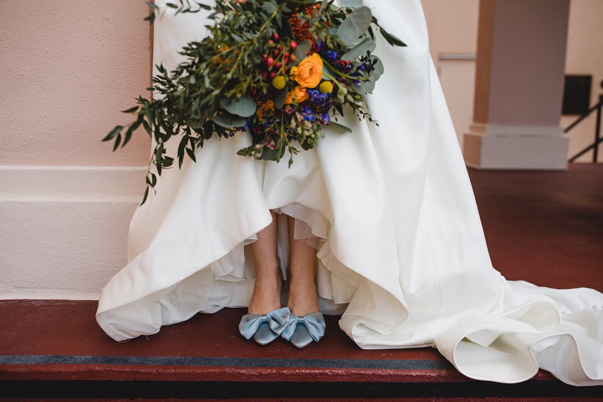 Bride's baby blue shoes and bouquet at downtown sarasota wedding