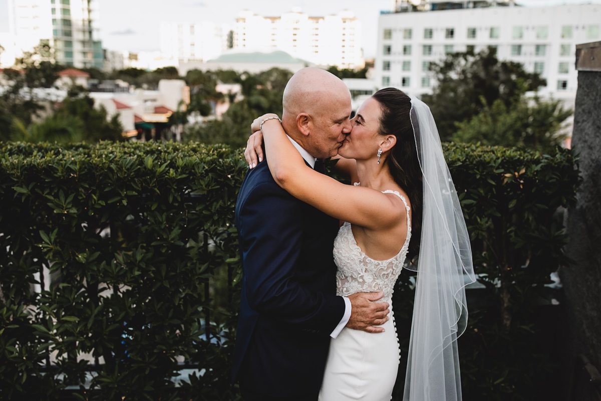 bride and groom kissing at their wedding in sarasota florida, sarasota wedding on the rooftop of sage restaurant