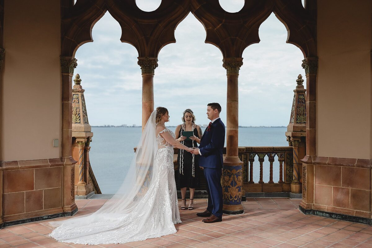 couple getting married eloping at ca d'zan tower at ringling museum in sarasota florida, wedding photography by juliana montane photography