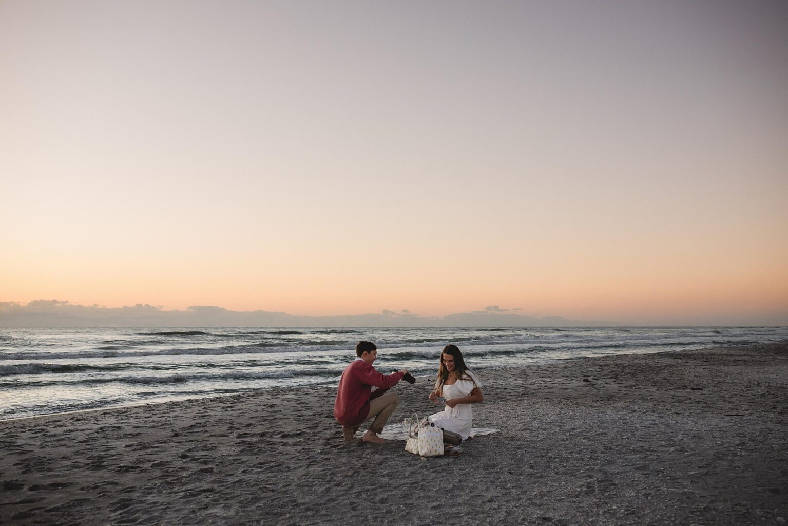 Newlywed couple having a romantic picnic on the beach after their sarasota beach proposal