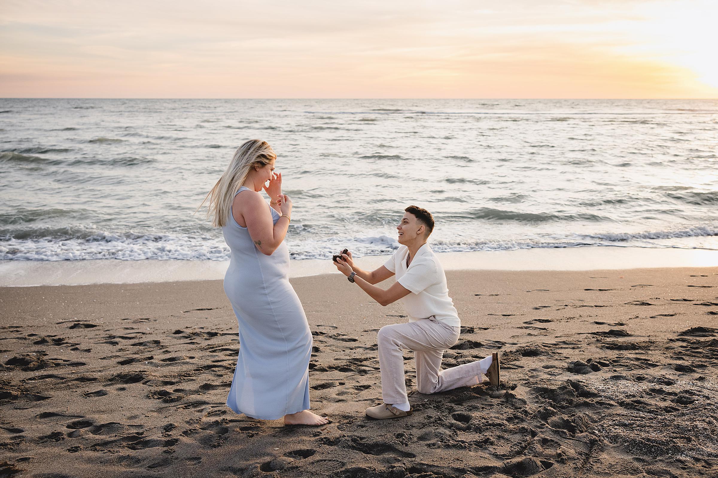 same sex couple proposal on venice beach in florida. Photographed by Juliana Montane Photography