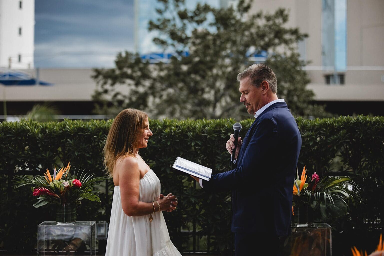 Bride & Groom reading vows during wedding ceremony at Sage Restaurant in downtown Sarasota, FL photographed by Juliana Montane Photography