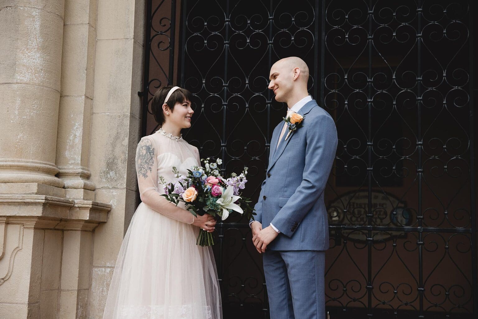 Bride & Groom getting married at the Sarasota Courthouse outside in the courtyard photographed by Juliana Montane Photography